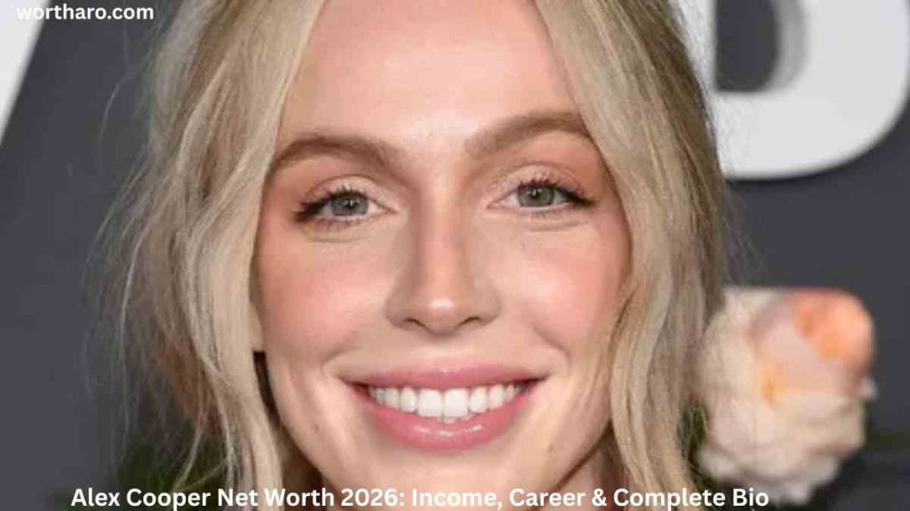 Alex Cooper smiling at an event while discussing her Alex Cooper Net Worth