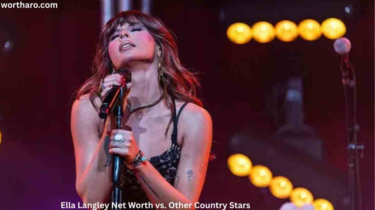 Ella Langley Net Worth – Country singer Ella Langley performing live on stage with a microphone during a concert.