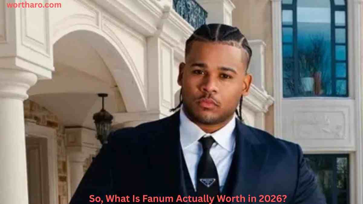 Fanum wearing a suit at a formal event, featured in an article about Fanum Net Worth