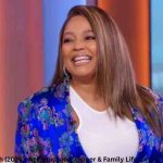 Kim Fields Net Worth: Kim Fields smiling during a TV interview discussing her career, earnings, and success.