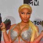 Nicki Minaj Net Worth 2026 – Nicki Minaj posing at the MTV Europe Music Awards in a glamorous silver outfit.