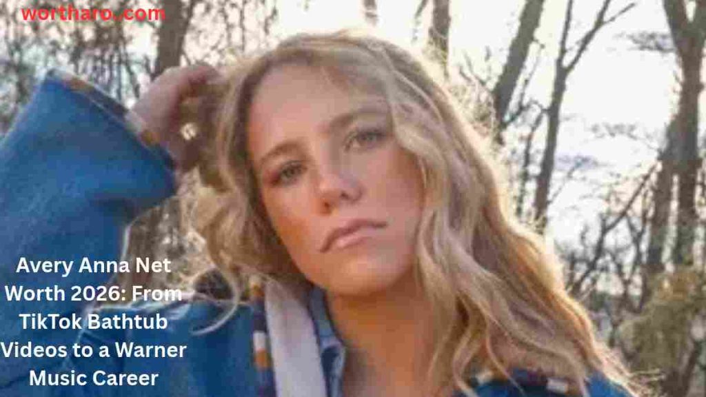 Avery Anna posing outdoors in a blue jacket during her rising country music career