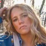 Avery Anna posing outdoors in a blue jacket during her rising country music career