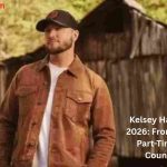 Kelsey Hart standing outdoors in a brown jacket and black cap, highlighting Kelsey Hart Net Worth and his rise as a viral country singer.