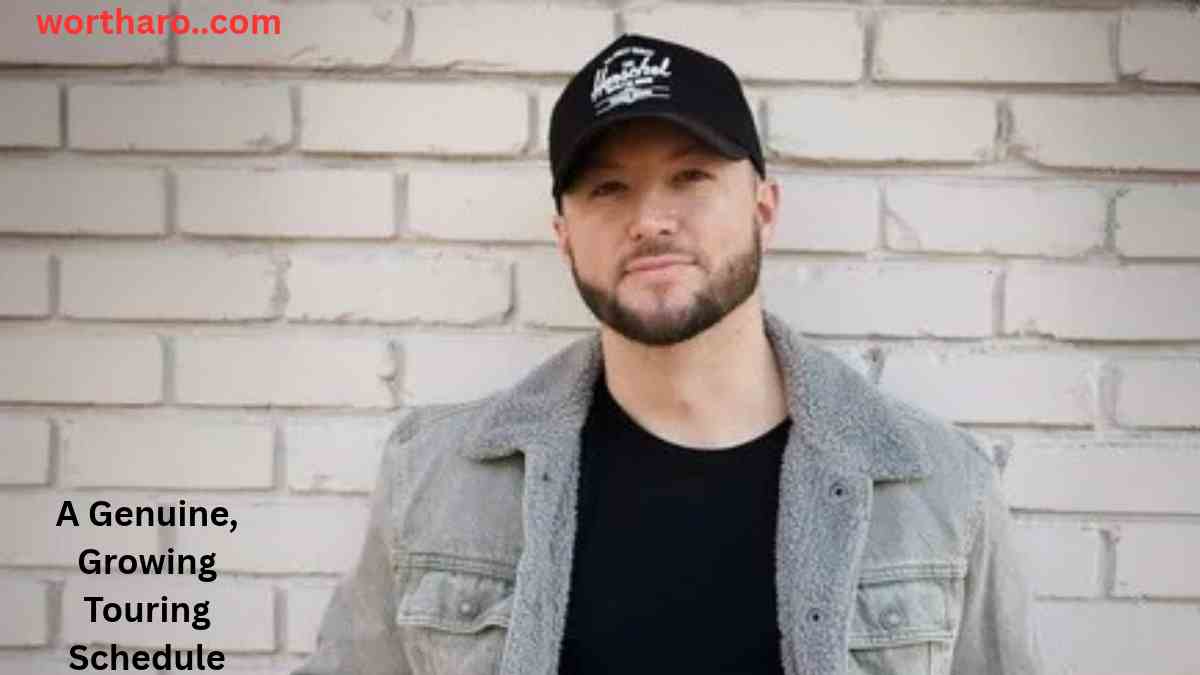 Kelsey Hart Net Worth – Kelsey Hart wearing a black cap and gray jacket during his growing music career.