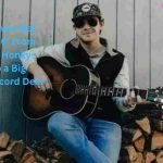 Cole Goodwin playing guitar for his rising country music career, featured in Cole Goodwin Net Worth