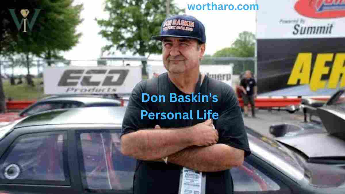 Don Baskin Net Worth 2026: Don Baskin standing beside a race car at a motorsports event, wearing a branded cap and black T-shirt.