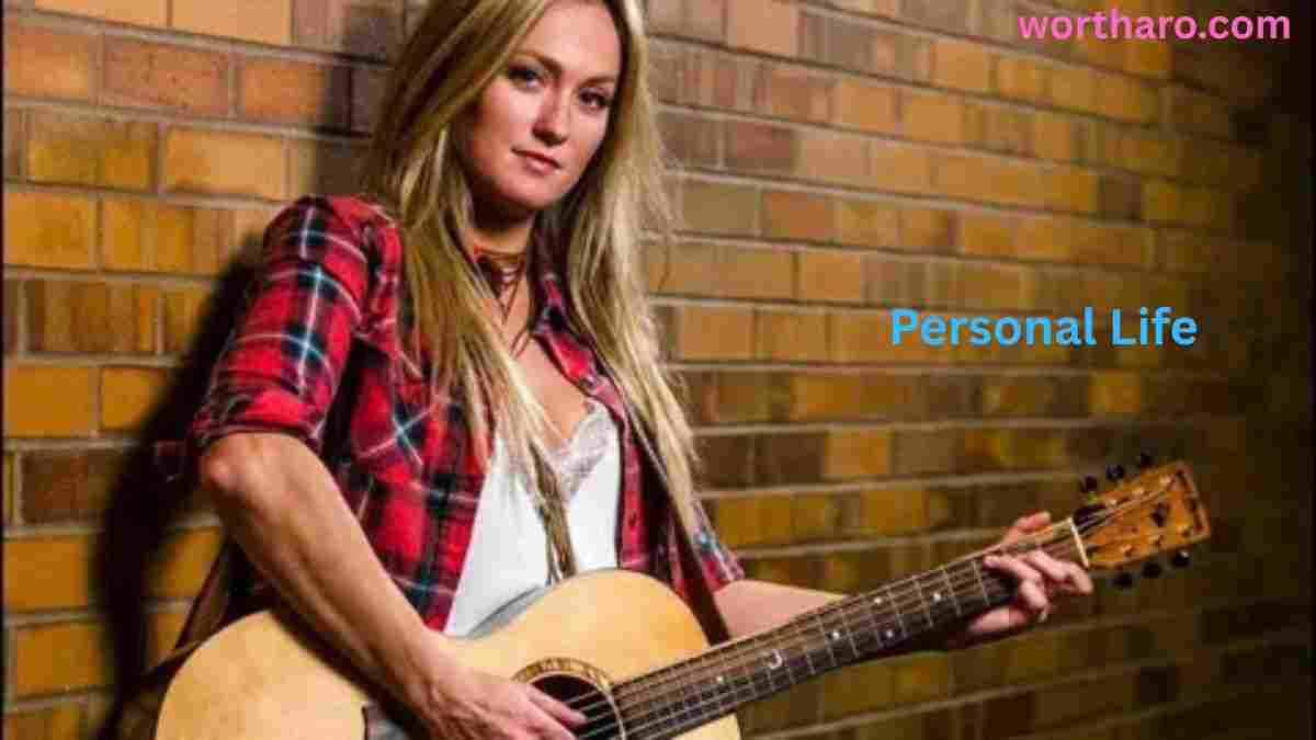 Meghan Patrick Net Worth as the country singer plays guitar during her personal life journey